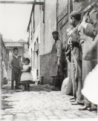 close-up shot of Dutfields Yard circa 1890, showing tourists on a very early Ripper tour.